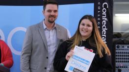 Registrar Don Duclos (left) presents St. Patrick High School student Shay Shchepanik with a conditional offer of acceptance to Confederation College and a $1000 entrance bursary