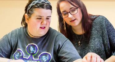 new banner photo - working with a student