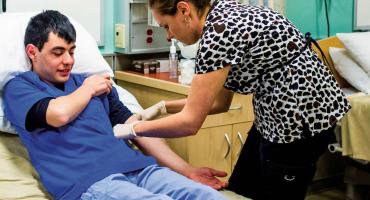 banner photo - Medical Laboratory Assistant taking a blood sample