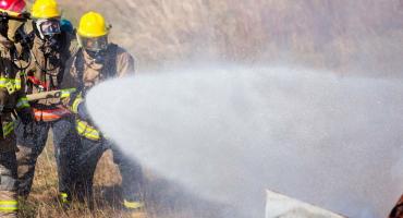 photo - students gain experience with fighting a vehicle fire