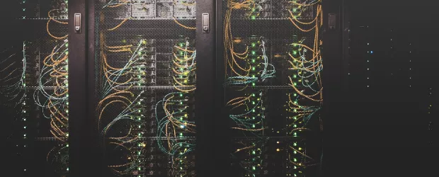 Computer server room with technicians performing maintenance