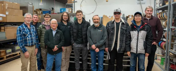 Confederation College students and Automation Now staff pose together during a skilled trades mentorship visit.
