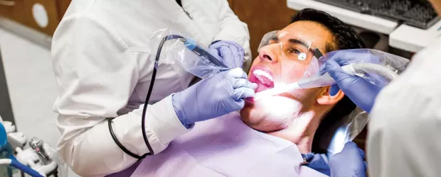 banner photo - polishing client's teeth
