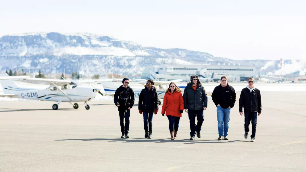 Aviation school - a group of people on a runway