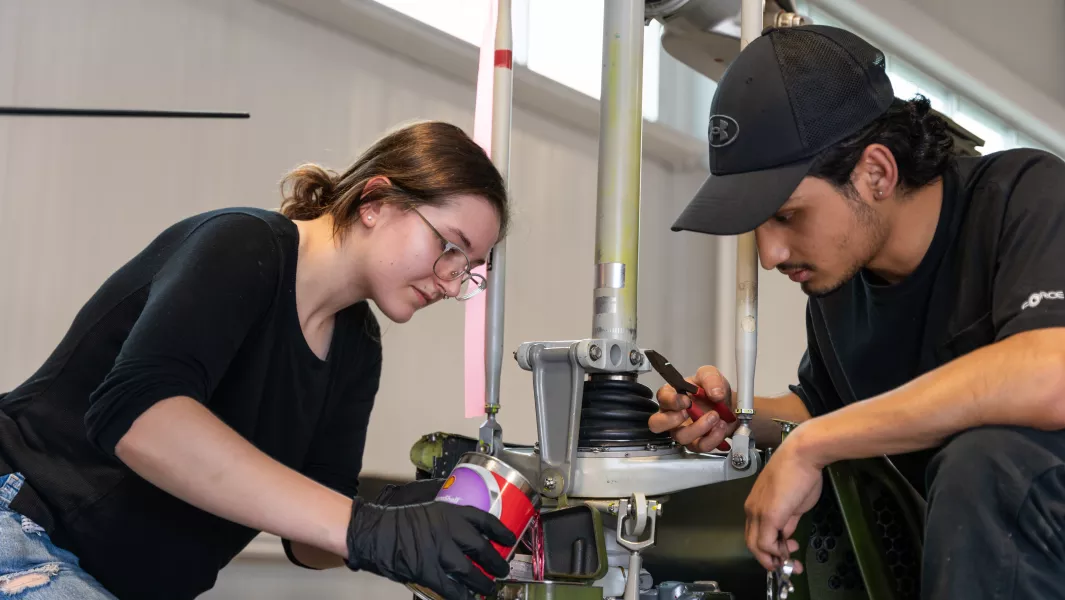 Students work on aviation engine