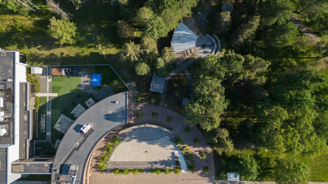 Aerial view of Confederation College outdoor gathering space surrounded by trees and walking paths