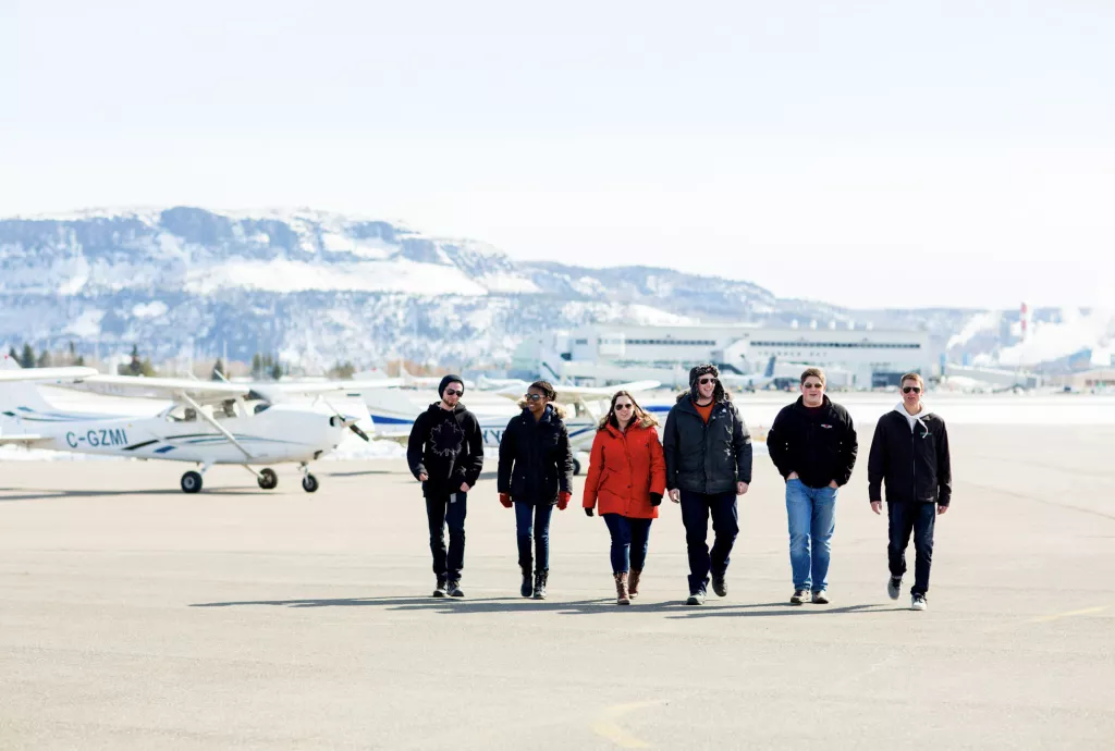 Aviation school - a group of people on a runway