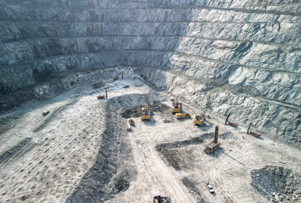 Large quarry with excavators and drills