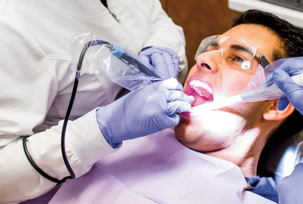 banner photo - polishing client's teeth