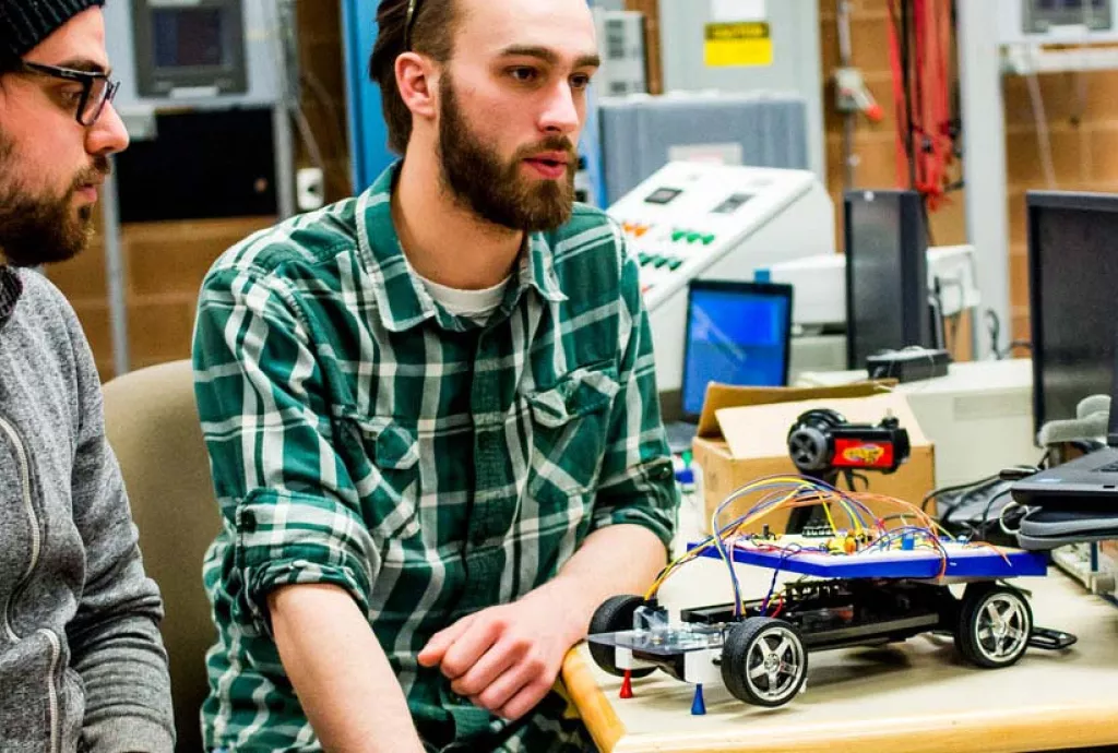 photo - Electrical Engineering students showing their project "Virtual Differential with Traction Control"