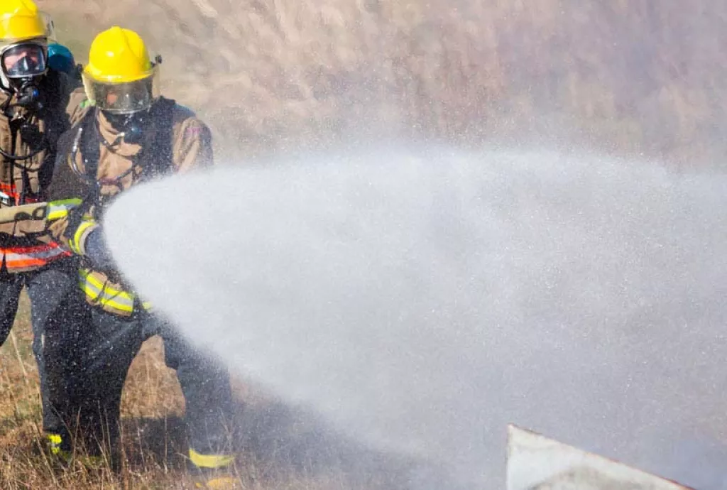 photo - students gain experience with fighting a vehicle fire