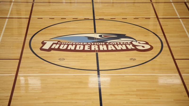 SUCCI Wellness Centre - Thunder Hawks logo in gym floor