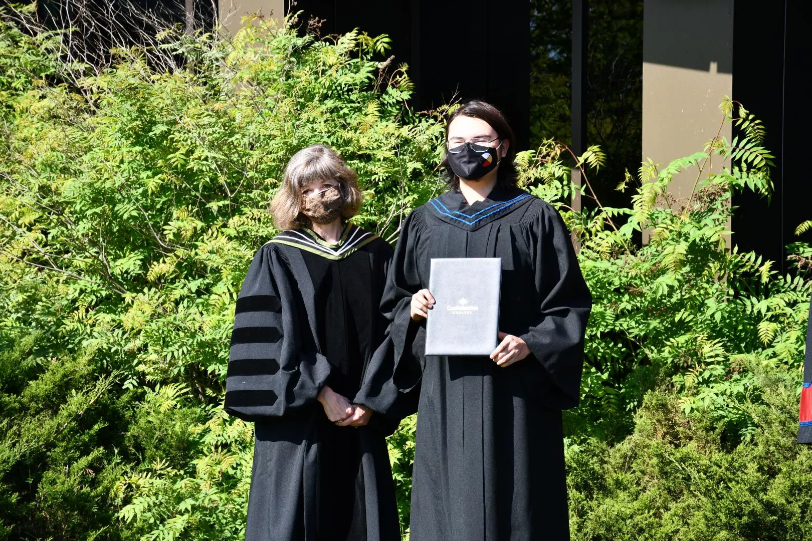 President Kathleen Lynch presents Aboriginal Community Advocacy diploma to Tyrell Monias