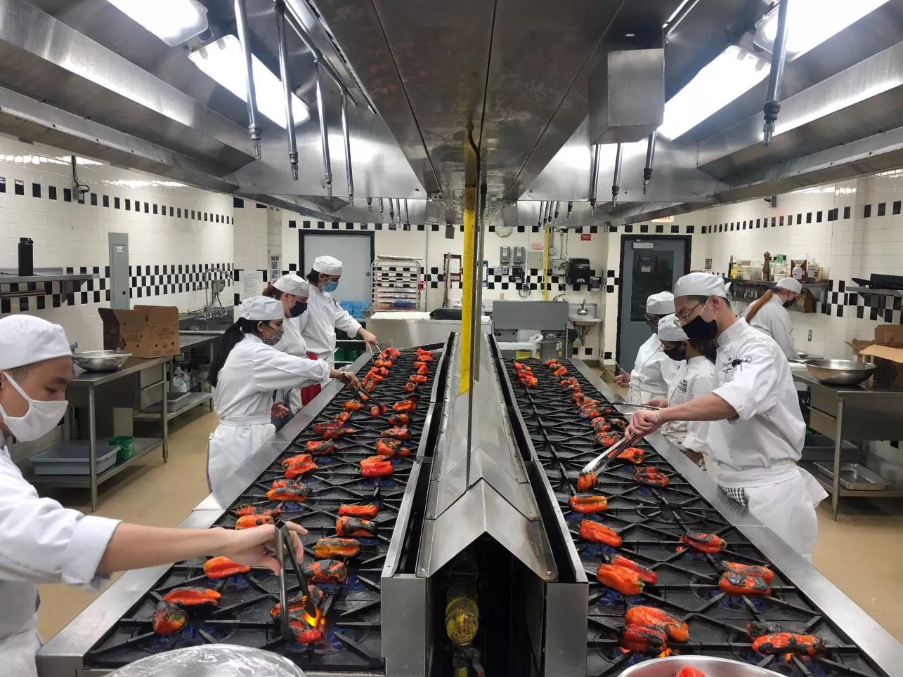 Second-Year Culinary Management students preparing roasted red peppers