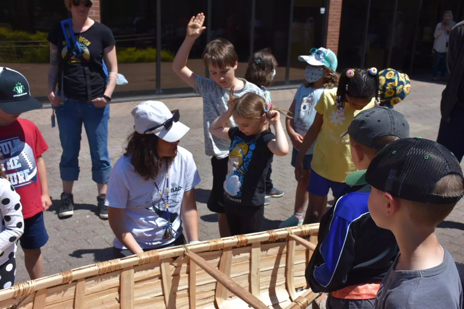 Raquel explaining canoe to Elise MacGill Public School