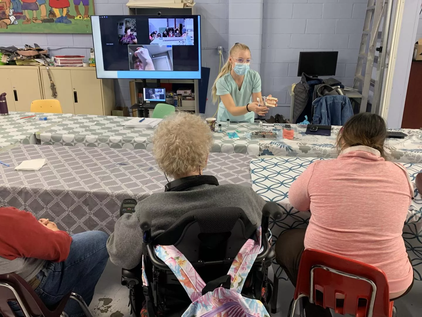 Year 3 Dental Hygiene student educating March of Dimes participants 