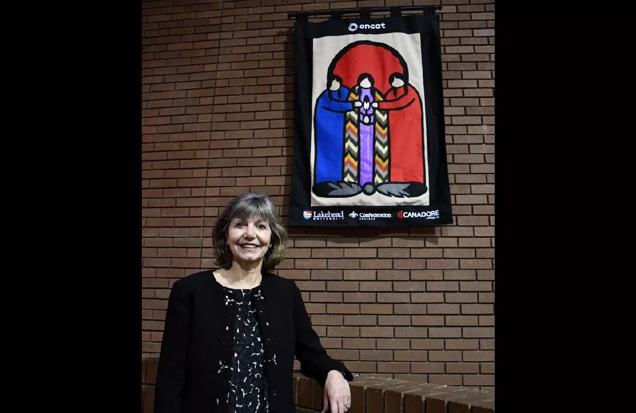 Confederation College President Kathleen Lynch with the Quilt Made to Honour the MOU 